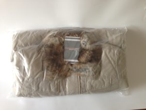 A puffy winter jacket sealed in a package