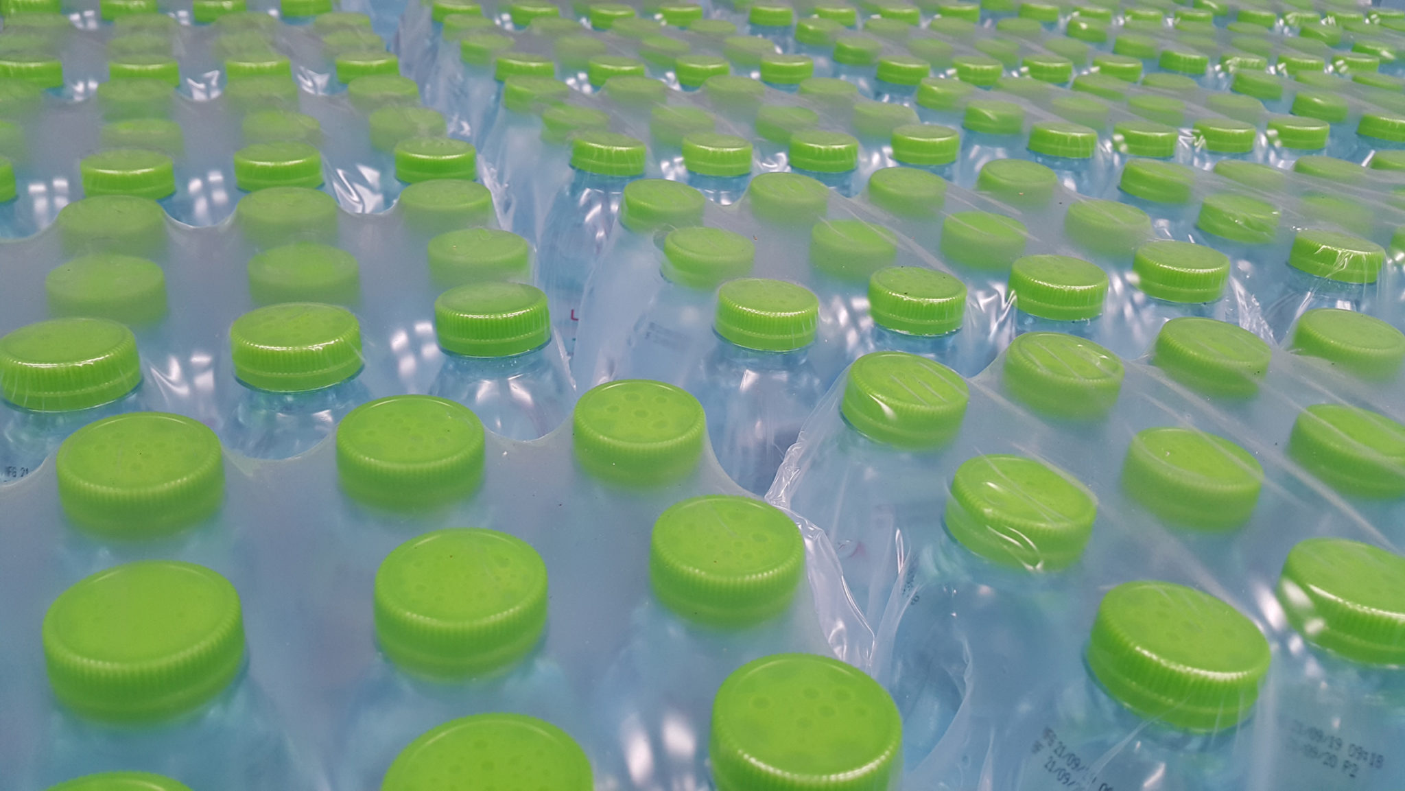 water bottles in shrink bundling film